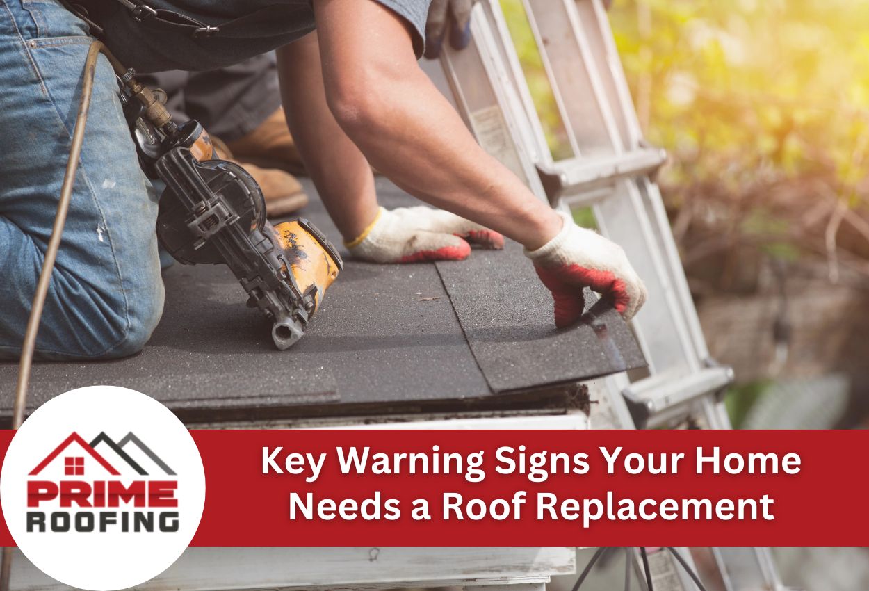 Roofer installing asphalt shingles with nail gun on residential roof, showing professional roofing work and safety