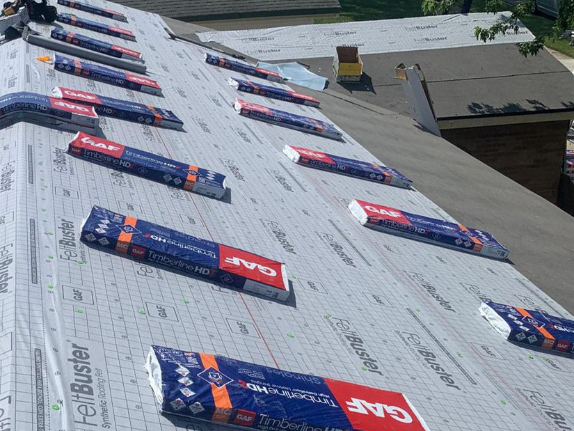 Roof construction with GAF TimberTex HD shingles laid over synthetic underlayment on residential building